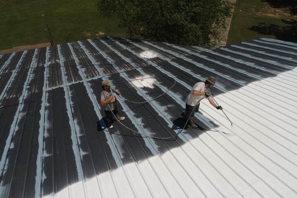 Professional roof coating being applied by Northway Roofing in Santa Fe, NM